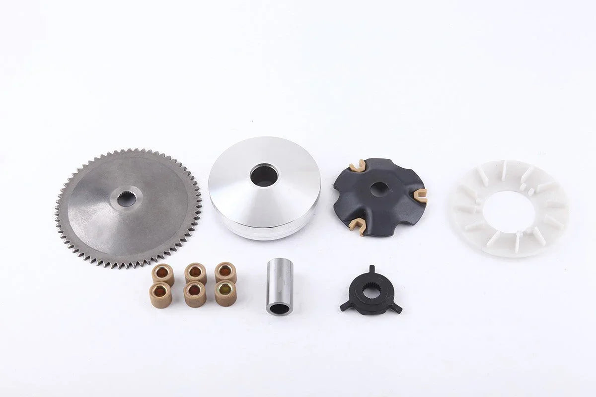 Scooter or motorcycle variator clutch parts including metal gear, rollers, and plastic components on white background