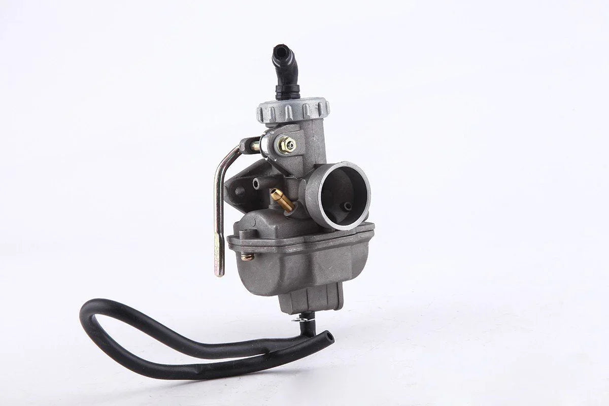 Gray metal carburetor with black rubber hose on white background