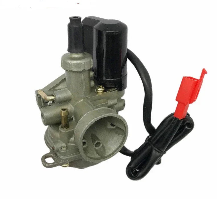 Close-up of a metal carburetor with black electrical component and attached wire with red connector