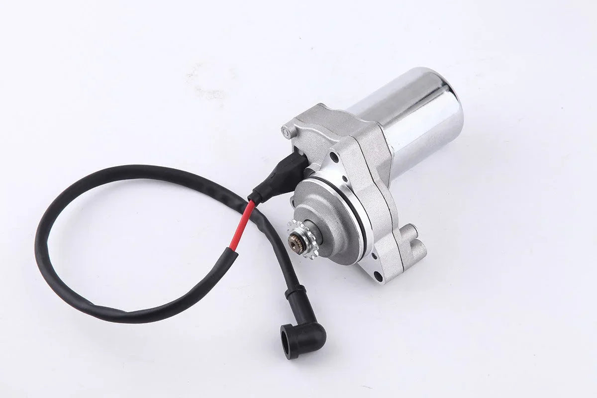 electric motor with attached black and red wiring on white background