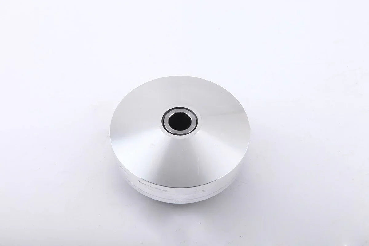 Shiny silver metal pulley wheel with central hole on white background