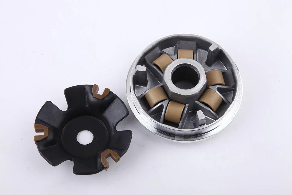 metal scooter variator clutch with brown rollers and black plastic fan on white background