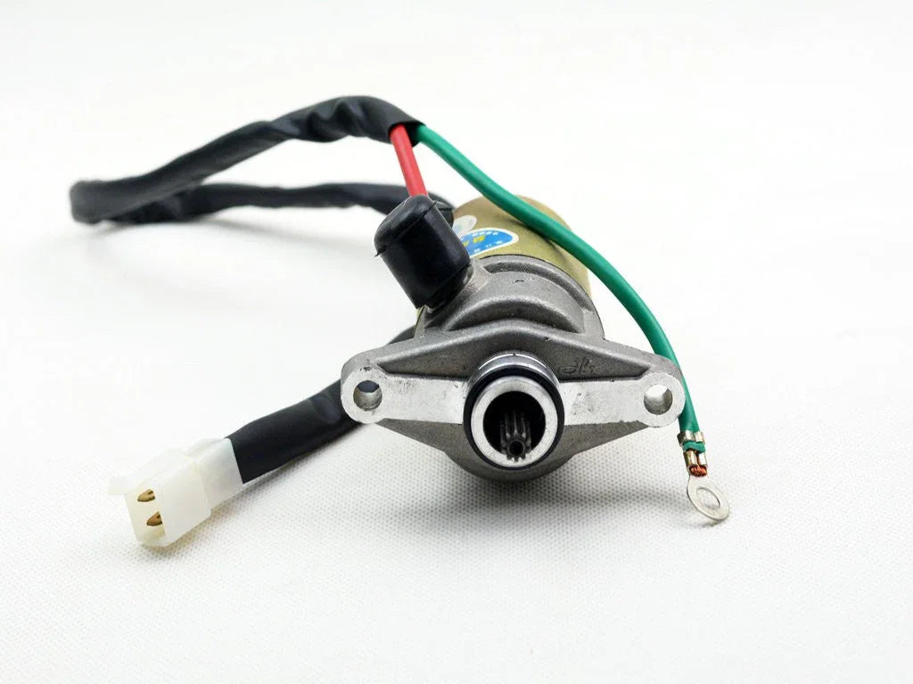 Electric starter motor with wiring harness and connector on white background