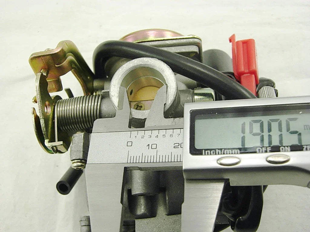 digital caliper measuring 19.05 mm inside diameter of a carburetor throttle body