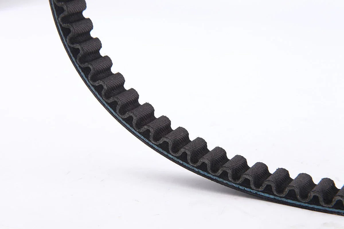 Close-up of a black rubber timing belt with teeth on a white background