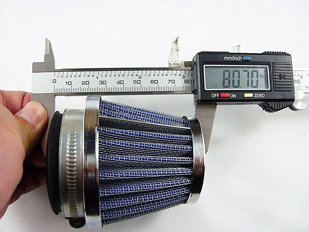 Hand measuring blue cone air filter with digital caliper showing 80.70 mm length