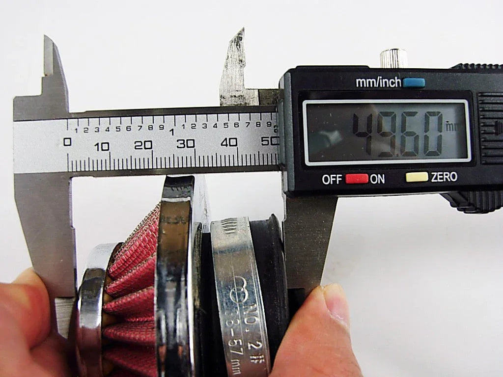 Digital caliper measuring diameter of red conical air filter showing 49.60 mm