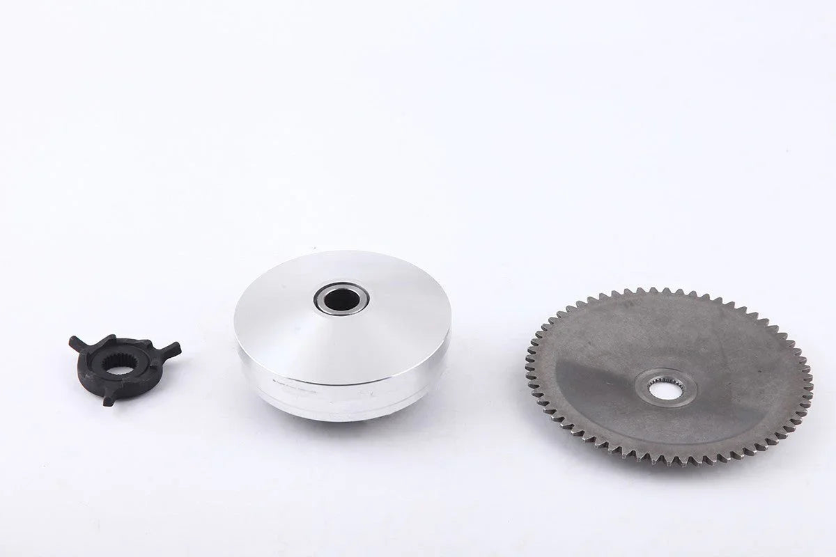 Three mechanical parts on white background: small black plastic gear, silver metal pulley, large gray metal gear