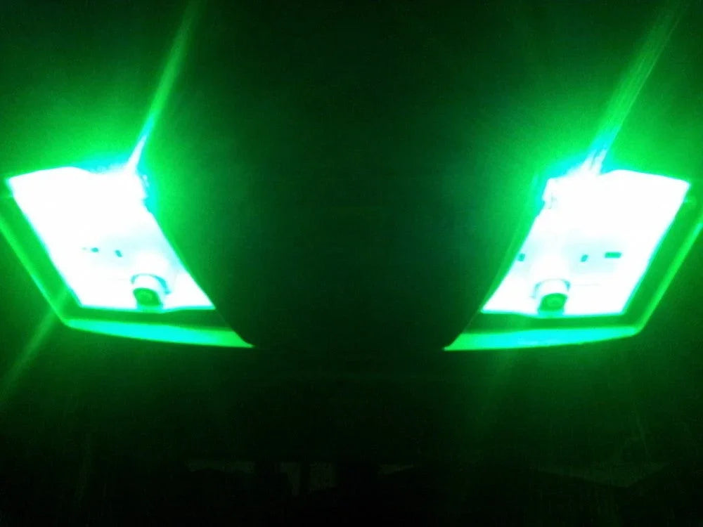 Bright green LED lights glowing in dark, mounted on a black fixture