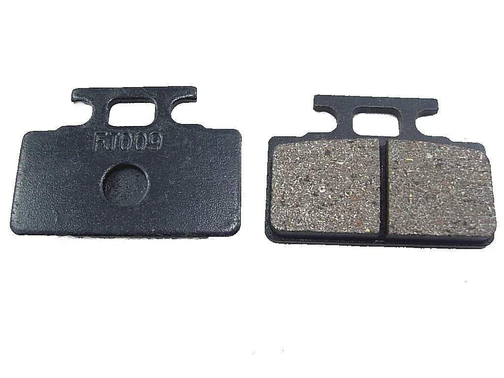 Chinese Parts USA brake pads for 125cc motor vehicles, showing the black brake pad with metal backing in a close-up shot.
