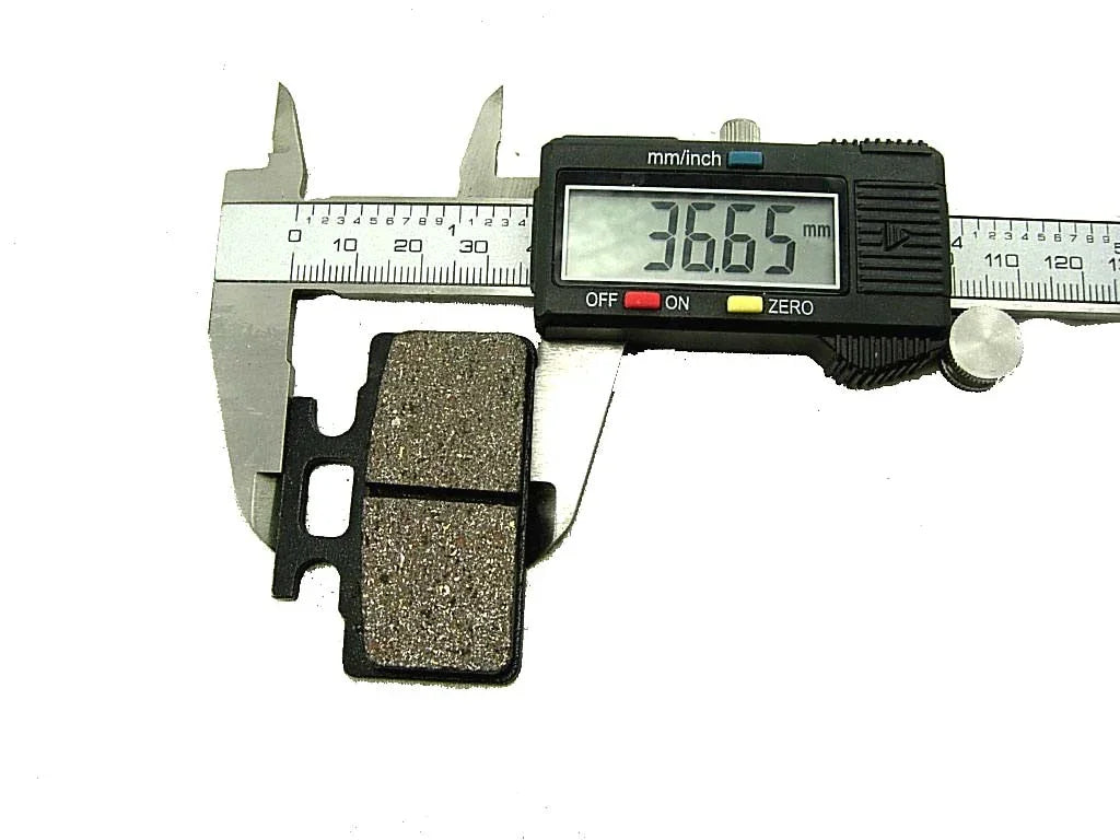 Chinese Parts USA brake pads for 125cc motor vehicles, close-up of black brake pad set on a clean background