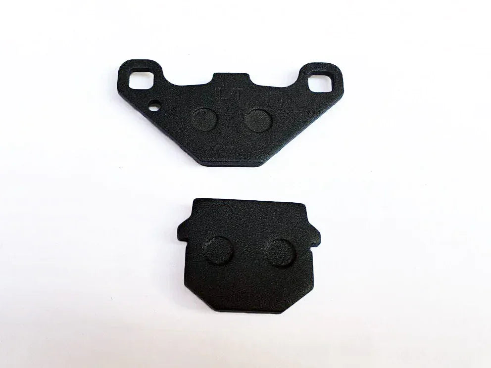 Black motorcycle brake pads for dirt bikes, ATVs, scooters, and go-karts — durable replacement parts