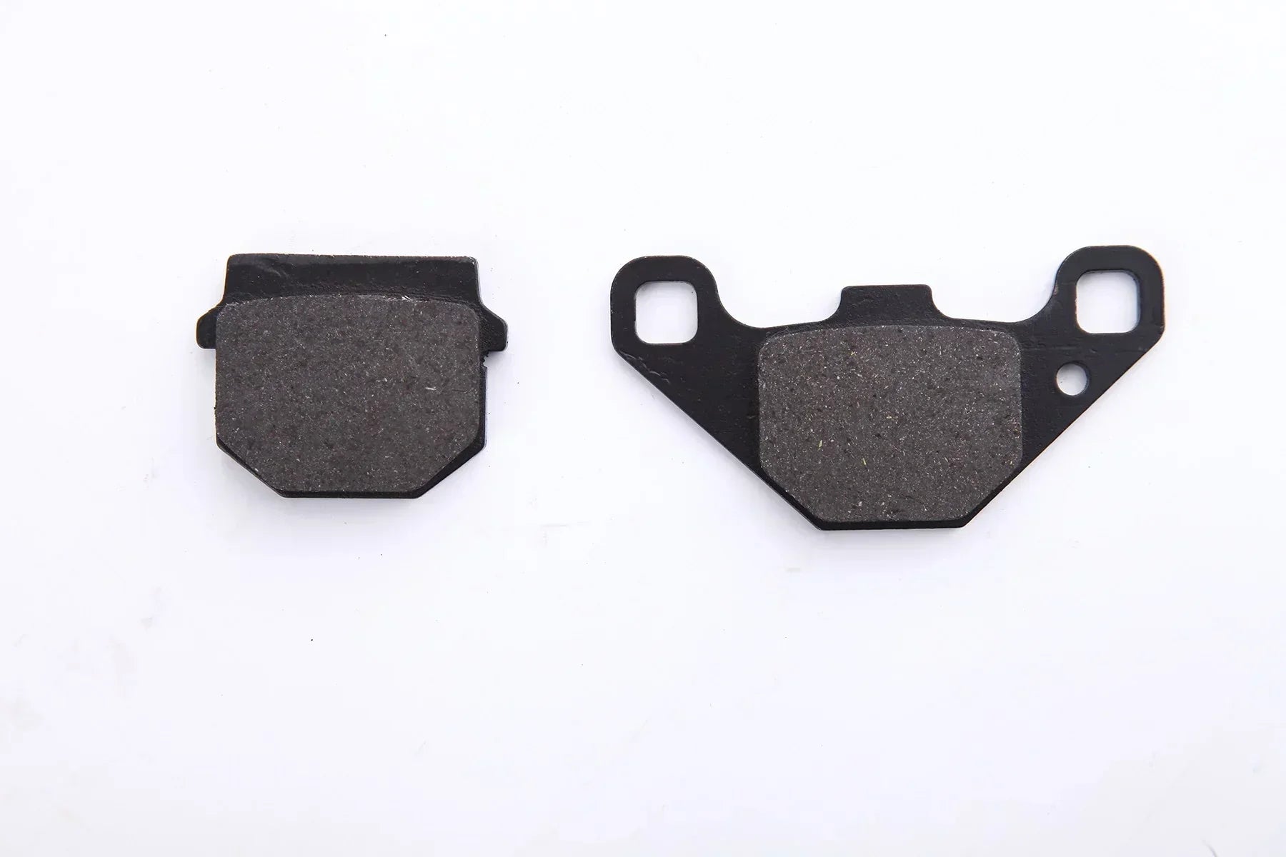 Motorcycle brake pads for dirt bikes, ATVs, and scooters — durable friction material with metal backing plates