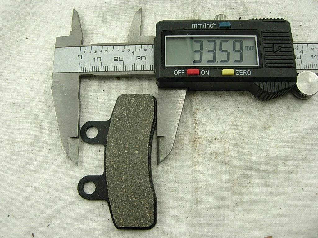 Chinese Parts USA 125cc dirt bike brake pads set showing front brake pads with 58.69mm size for off-road motorcycle braking.