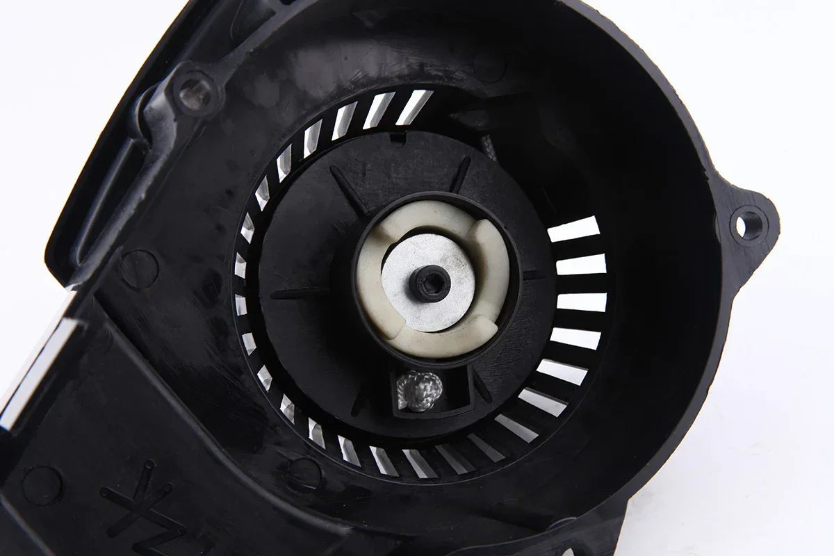Black plastic fan housing with central motor mount for scooter or ATV cooling system
