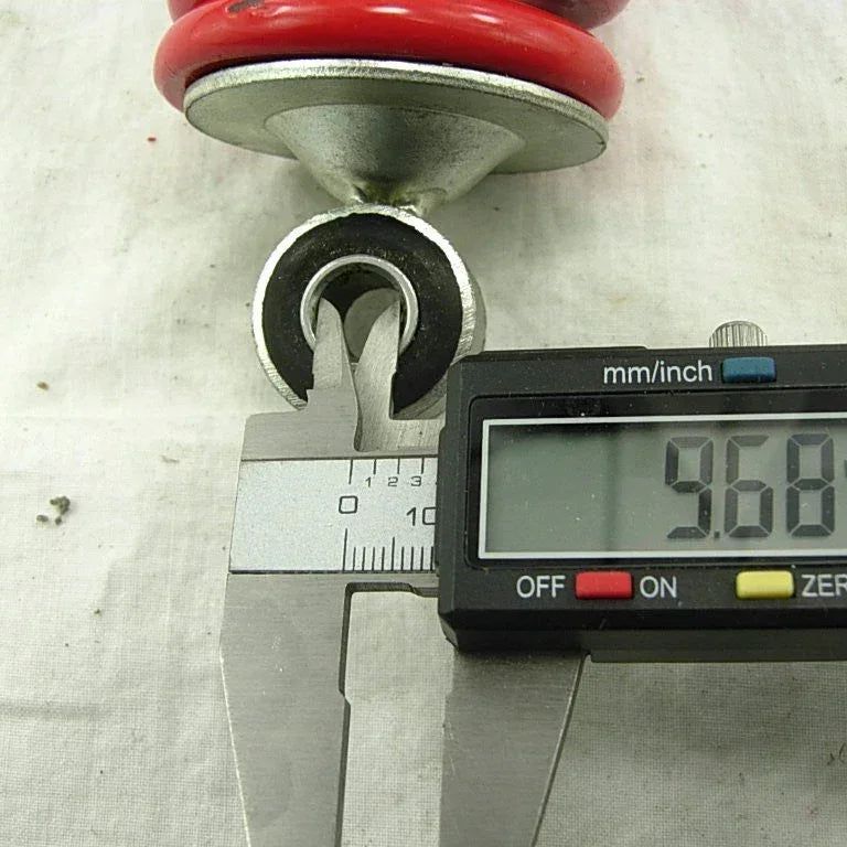 10.2-inch 260mm rear shock absorber for dirt pit bikes and ATVs from ChinesePartsUSA, showing the metal coil and mounting points.