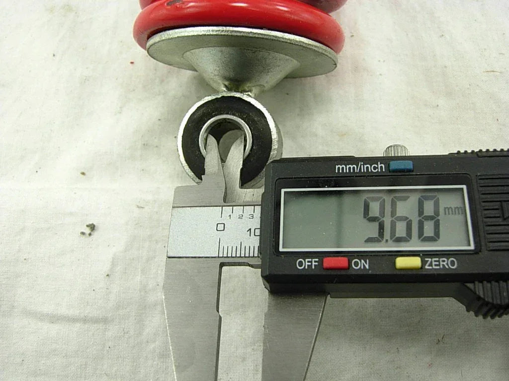 10.2-inch 260mm rear shock absorber for dirt pit bikes and ATVs from ChinesePartsUSA, showing the metal coil and mounting points.