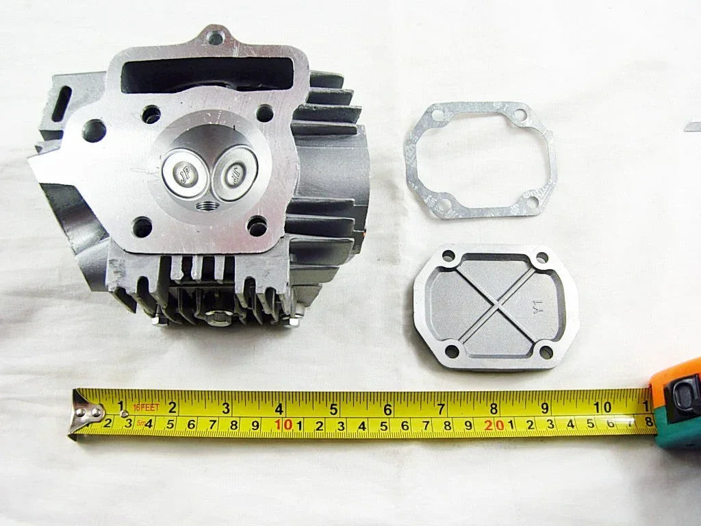 110cc engine cylinder head assembly for dirt bikes, manufactured by ChinesePartsUSA, featuring metallic components with engine mounting points.