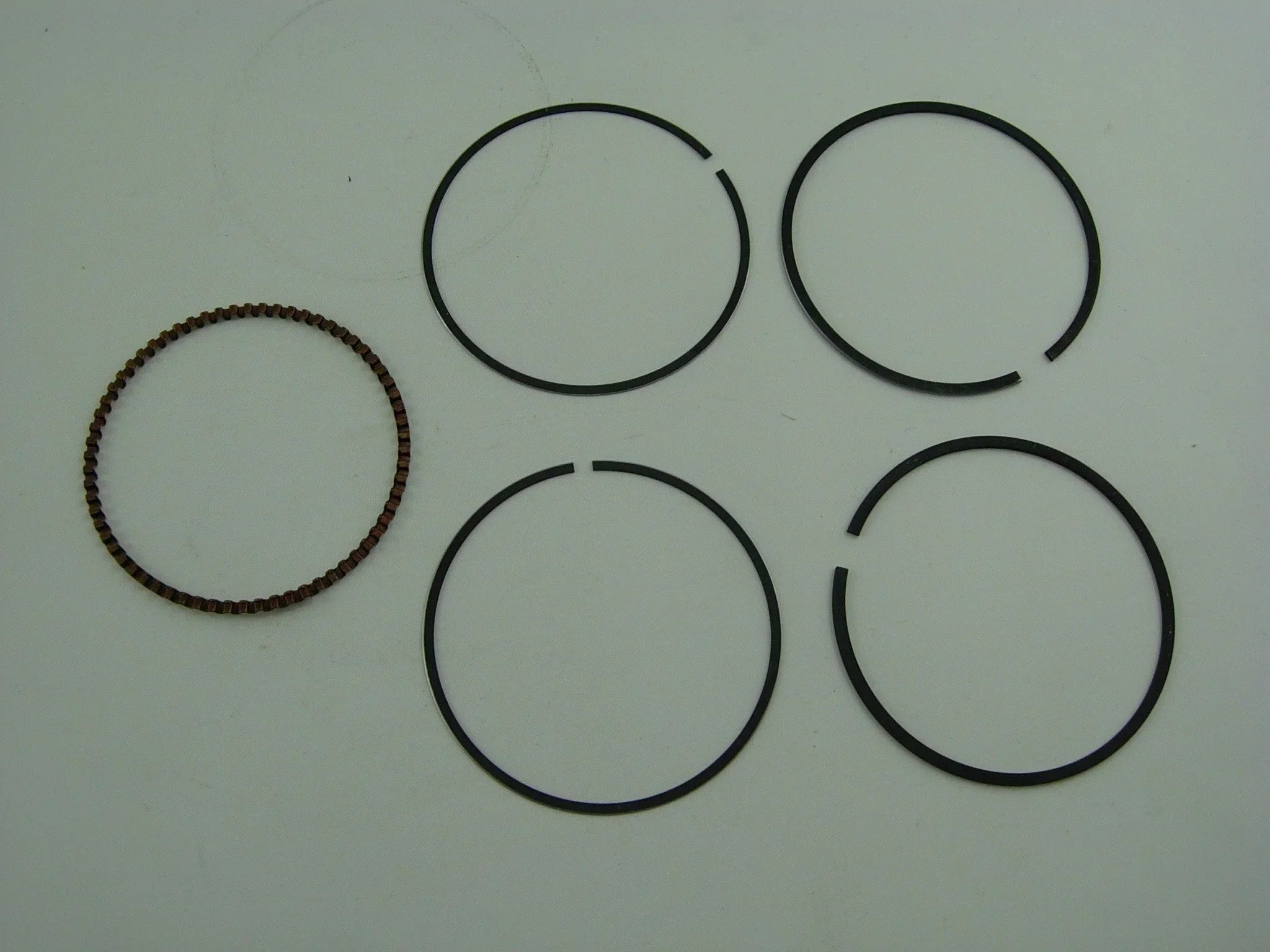 250cc CG engine piston ring set for dirt bikes from ChinesePartsUSA, includes multiple rings for engine performance.