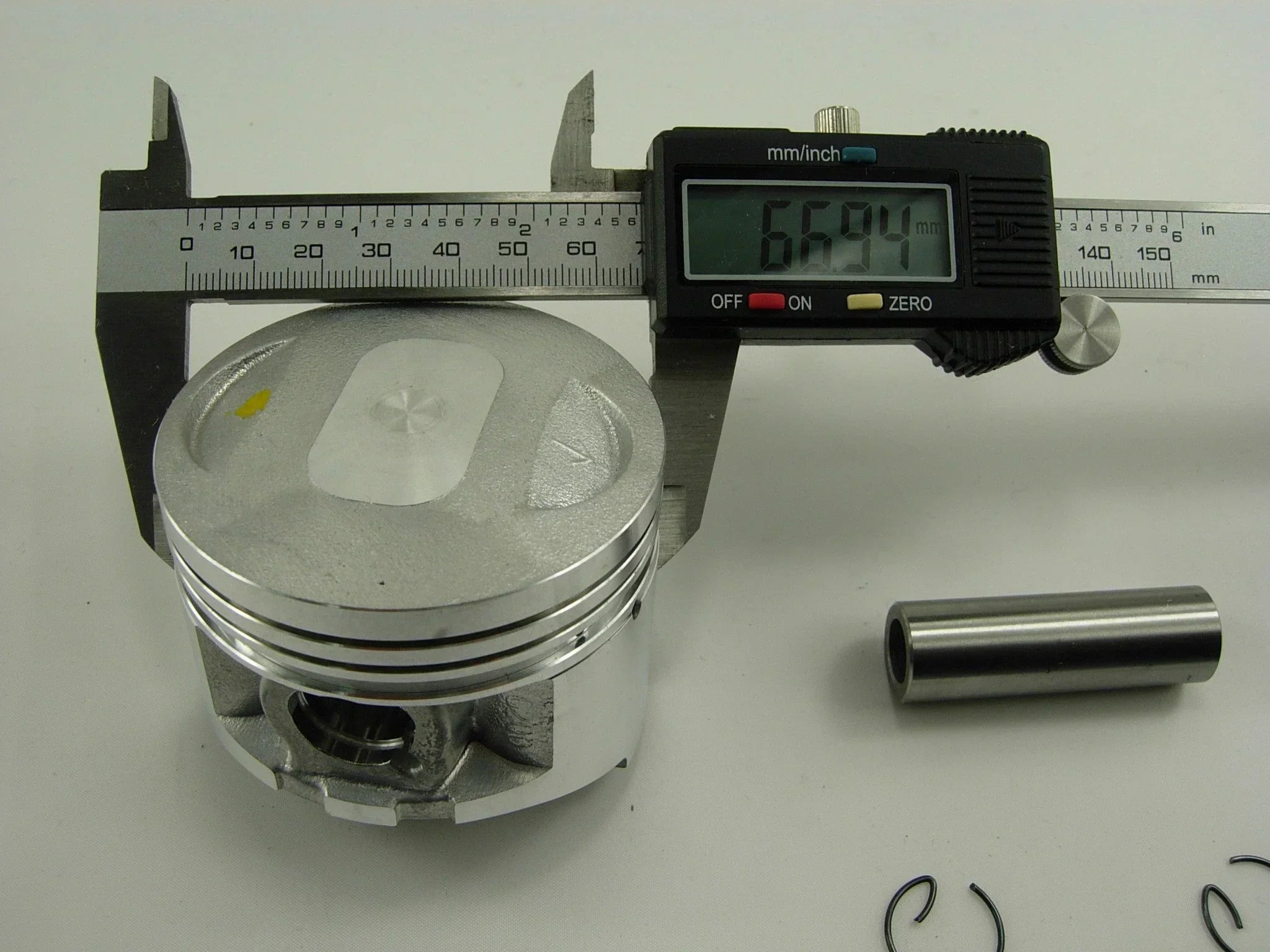250cc CG engine piston set for dirt bikes, showing metal pistons with rings and connecting components, from ChinesePartsUSA.