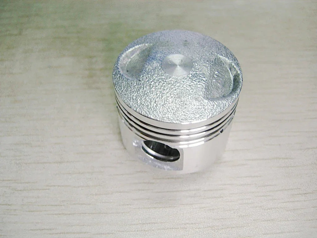 Horizontal 50cc engine piston set for dirt bikes, compatible with ChinesePartsUSA 50cc dirt bike engine parts.