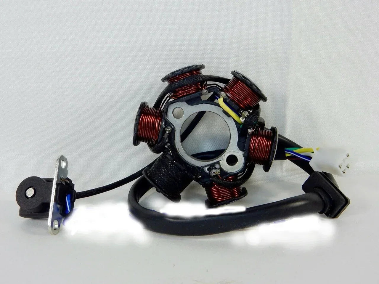 Motorcycle stator with red coils and wiring for electric or gas scooters, ATVs, and dirt bikes