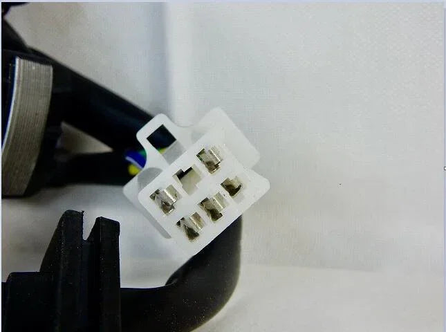 White electrical connector with metal pins for motorcycle or ATV wiring systems