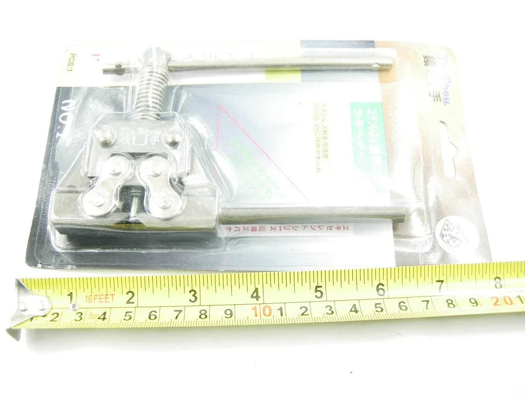 ChinesePartsUSA dirt bike chain rivet remover tool for chain repair and maintenance, black and silver metal tool in close-up image.