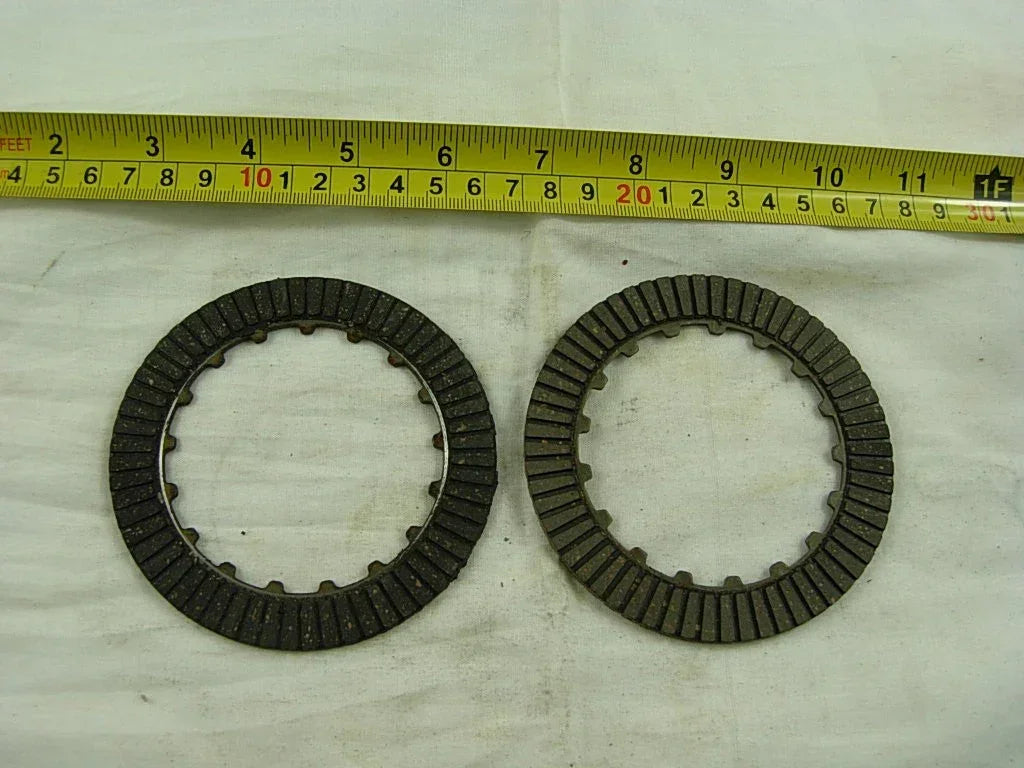 Manual clutch friction plate for 50cc to 125cc dirt bikes by ChinesePartsUSA, close-up of the metal plate detail.