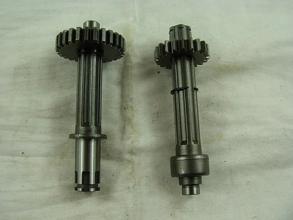 ChinesePartsUSA dirt bike transmission main and counter shaft with gears for 50cc-125cc models, featuring metal gears and precise machining.