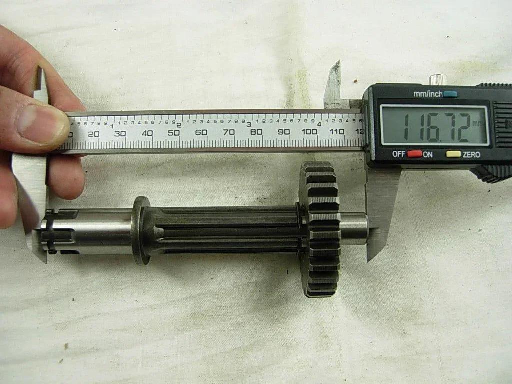 ChinesePartsUSA dirt bike transmission main and counter shaft with gears for 50cc-125cc models, showing gear components and shaft details.
