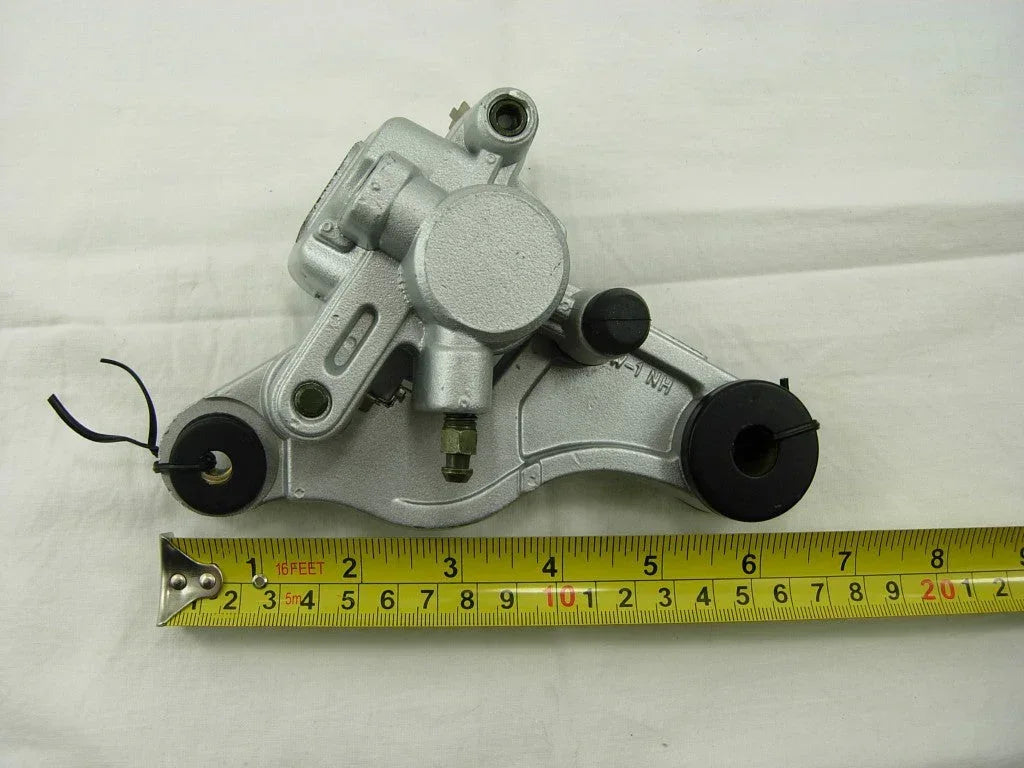 ChinesePartsUSA brake caliper for GY6 50cc scooter, durable motorcycle part with metal housing and mounting bolts visible.
