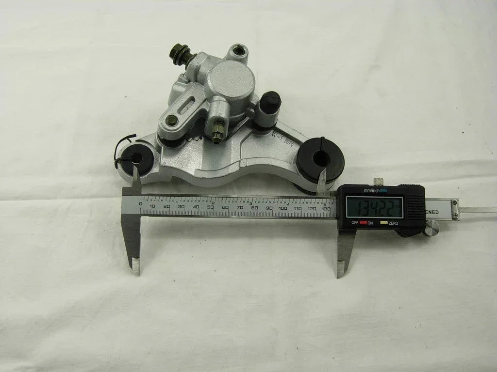 ChinesePartsUSA brake caliper for GY6 50cc scooter, showing the metal component with mounting brackets and pistons.