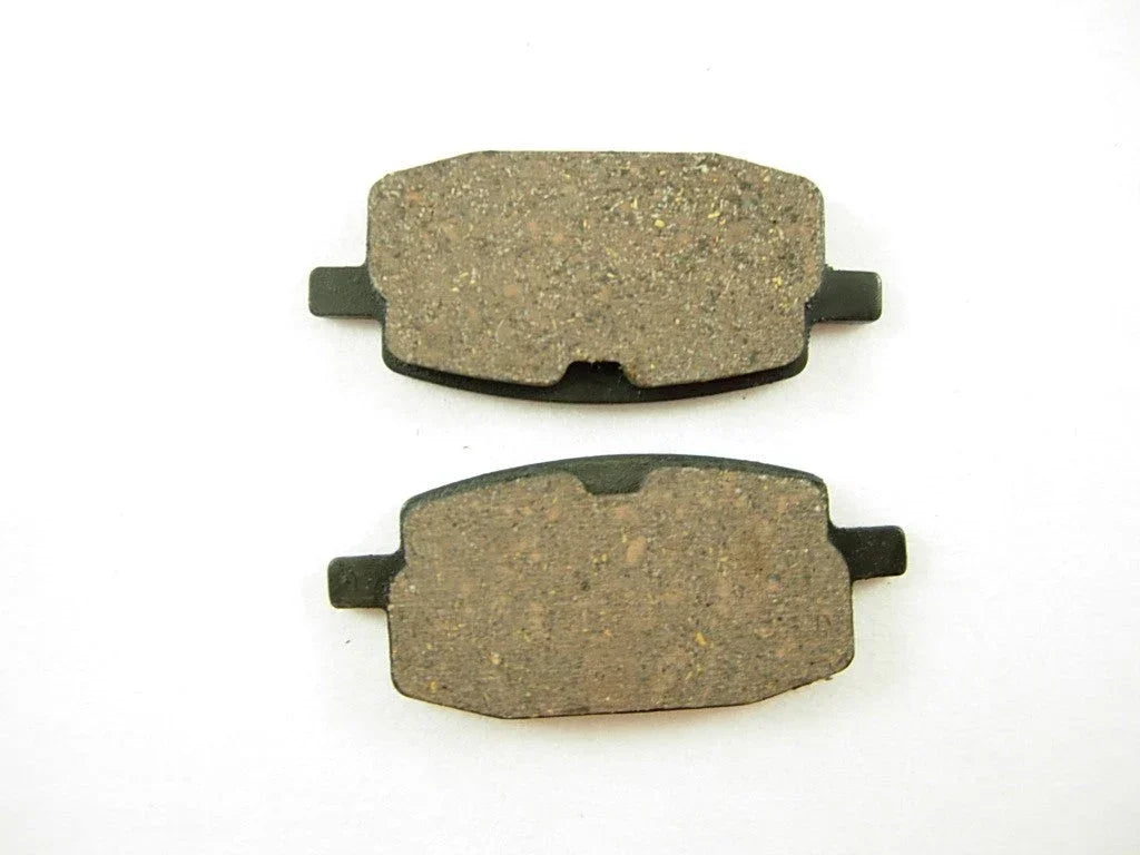 Set of GY6 50cc brake pads from ChinesePartsUSA, showing metal and friction material components for scooter braking system.