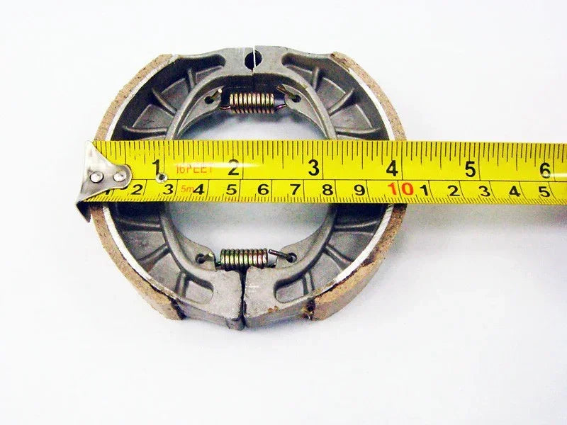 Brake shoe set for GY6 50cc scooter from ChinesePartsUSA, showing four brake shoes with metal components.