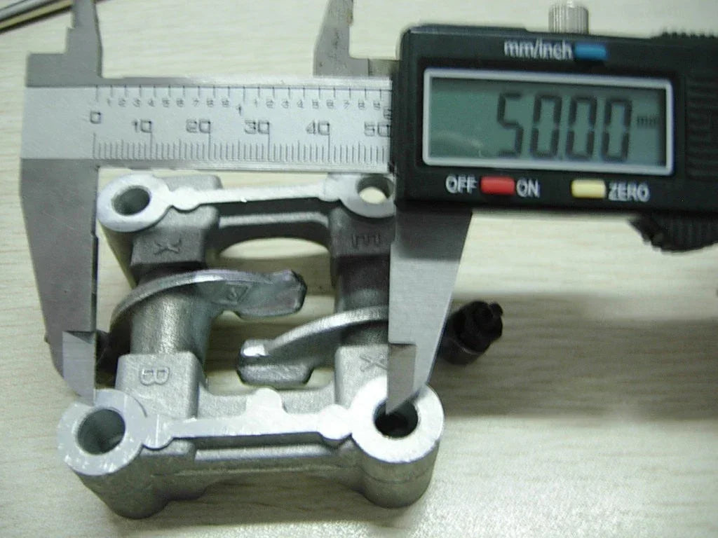 Cam holder retainer bracket and rocker arms for 50cc engine, 69mm valve, by ChinesePartsUSA, showcasing detailed metal components.