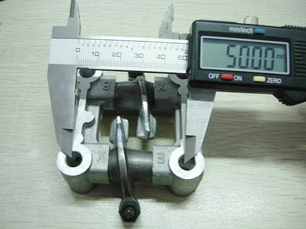 Cam holder retainer bracket and rocker arms for 50cc engine, featuring 69mm valves, by ChinesePartsUSA.