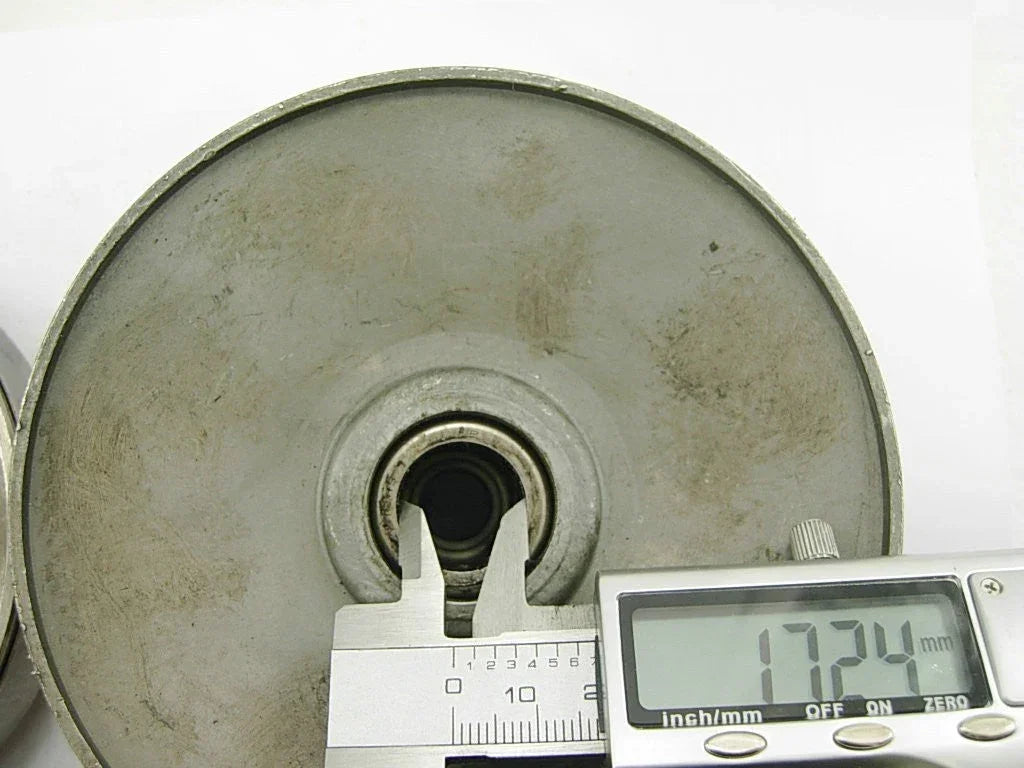 GY6 50cc clutch assembly with bell and digital caliper measuring internal diameter