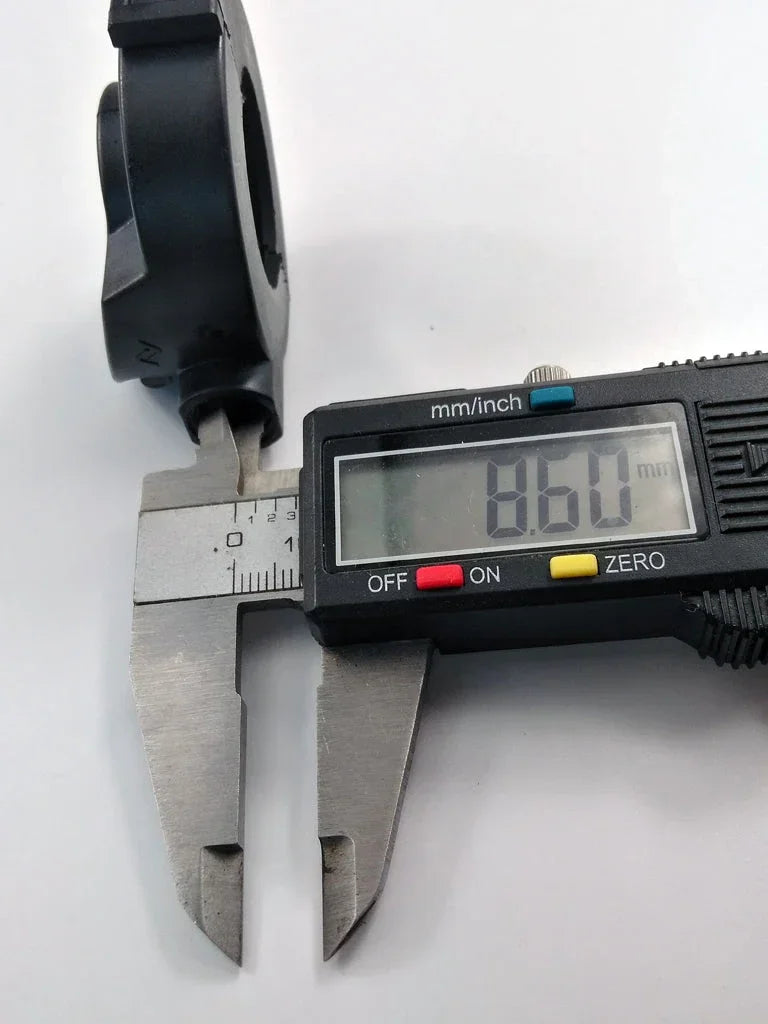 Digital caliper measuring black motorcycle part at 8.60mm, precision tool for ATV, dirt bike, or scooter components