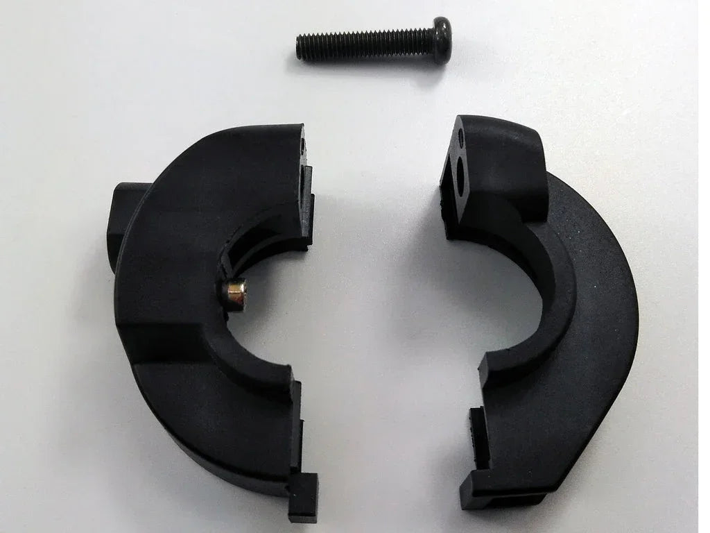 Black plastic clamp halves with mounting bolt for ATV or dirt bike exhaust system