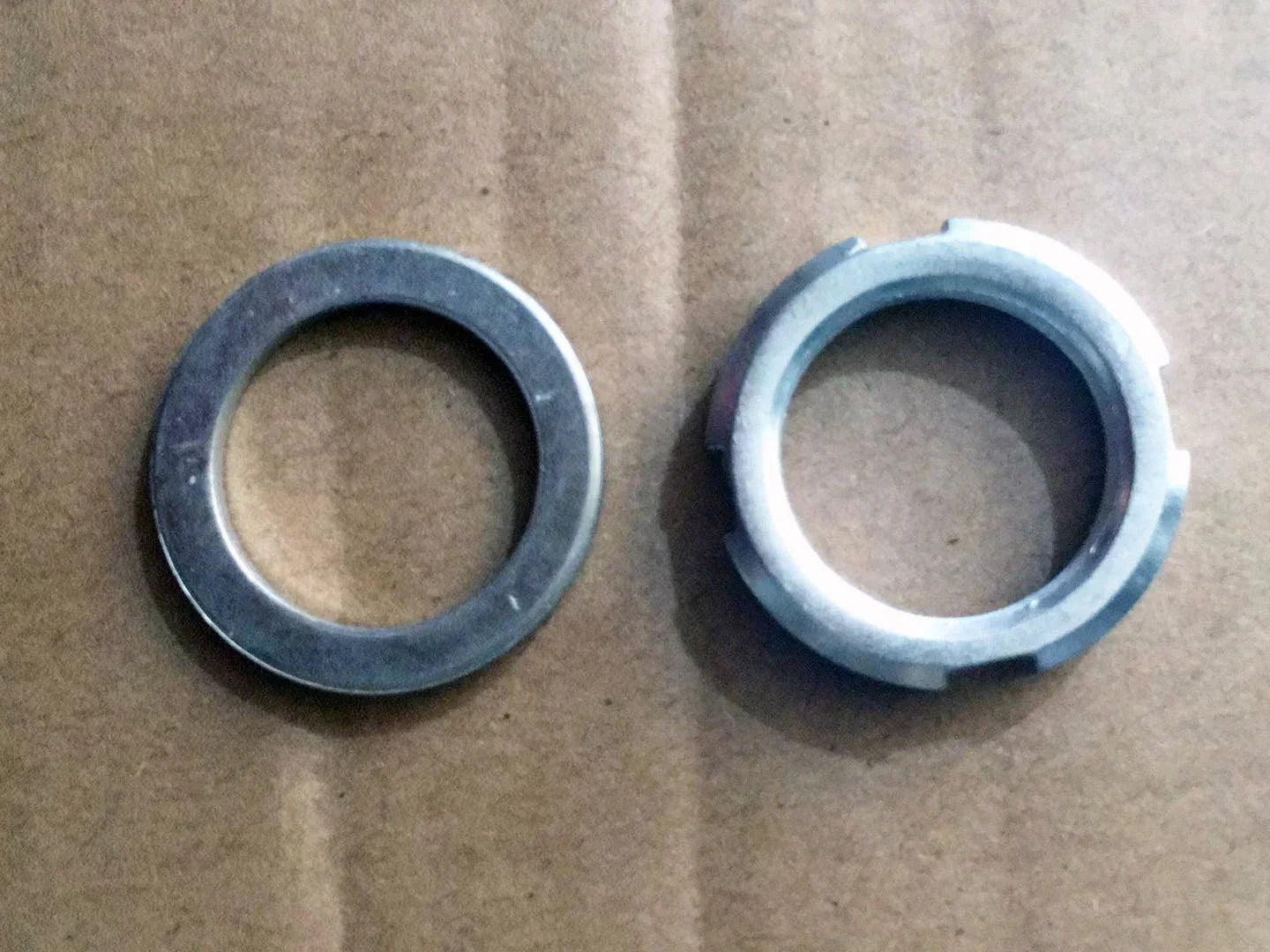 Starter clutch nut and washer set for GY6 125cc 150cc scooter or ATV, on cardboard