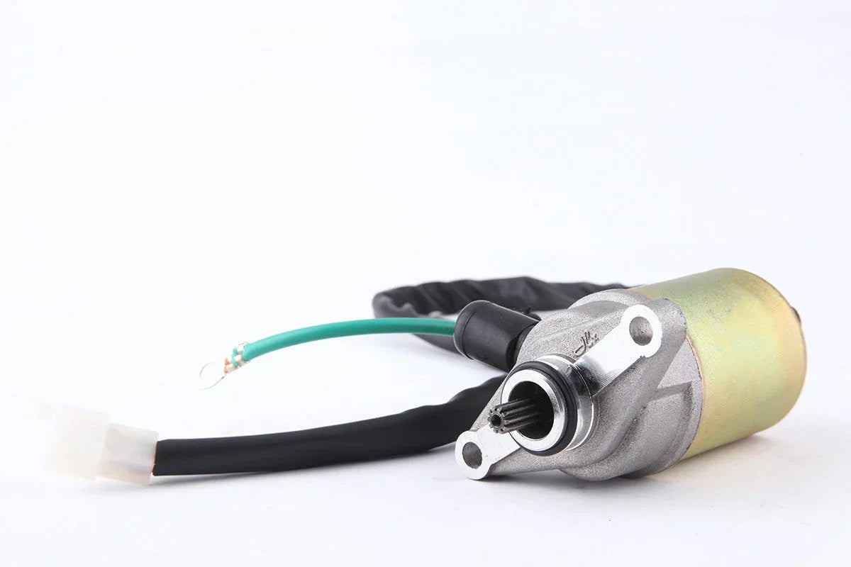 electric starter motor with wiring harness on white background automotive engine part