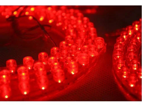 Close-up of circular red LED light arrays with individual diodes lit