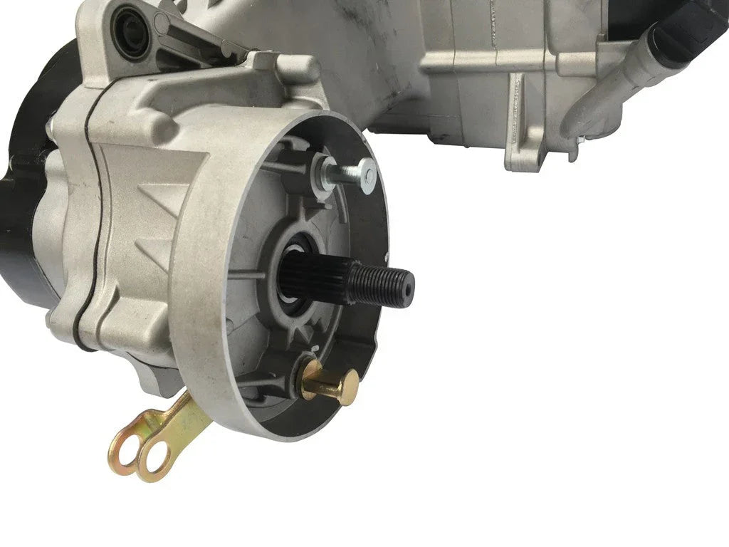 Close-up of silver electric motor gearbox with black central shaft and gold mounting bracket