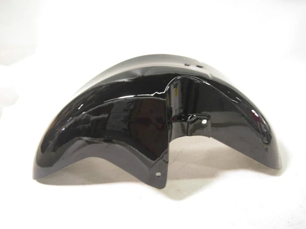Black wheel fender for bikes, with a curved design, mounted on a bicycle wheel for protection against mud and debris.