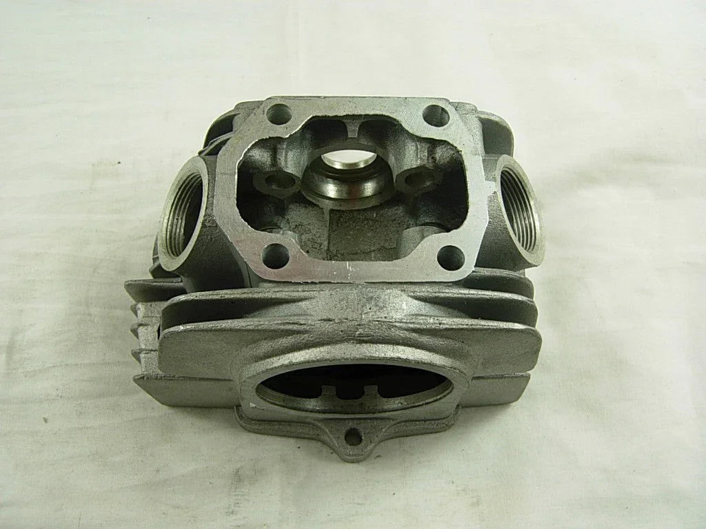 Horizontal 110cc dirt bike engine cylinder head for dirt bike parts, suitable for small motorbike engines.