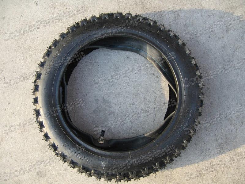 12-inch rear dirt bike tire with tube in 3.00-12 size, suitable for off-road motorcycle use, shown with tread pattern and sidewall.