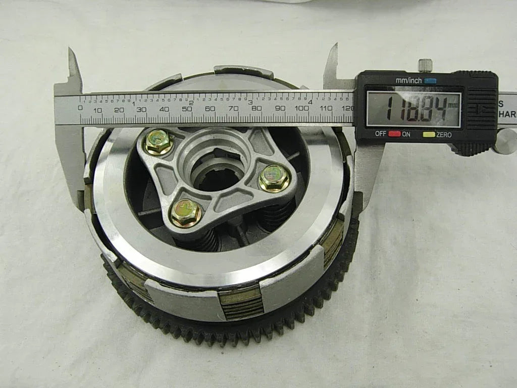 Dirt bike clutch assembly for Honda CG125 and CG150 125cc 150cc dirt pit bike engine, black metal and mechanical components.