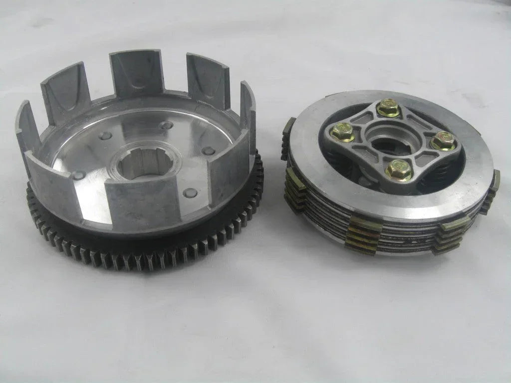 Dirt bike clutch assembly for Honda CG125 and CG150 125cc and 150cc pit bike engine, shown with metal parts and mechanism.