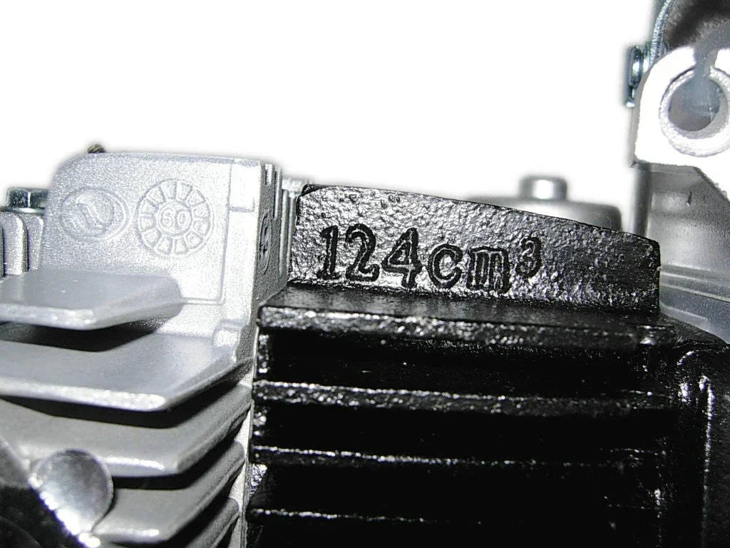 125cc Loncin dirt bike engine part, shown with metal components and engine casing, designed for off-road motorcycle maintenance.